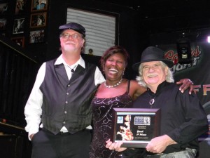 Dan Treanor Mike Hossler Erica Brown holding win plaque 2012 IBC Regional Band finals